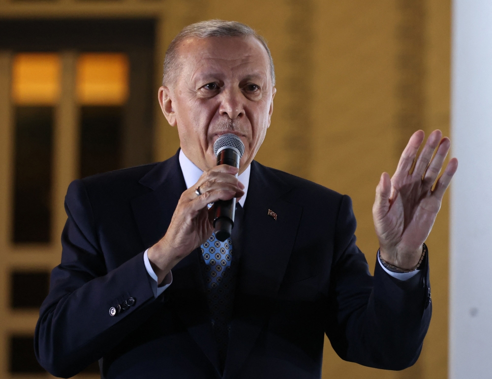 Turkish President Tayyip Erdogan addresses his supporters following his victory in the second round of the presidential election at the Presidential Palace in Ankara early on May 29, 2023. Photo by Adem ALTAN / AFP