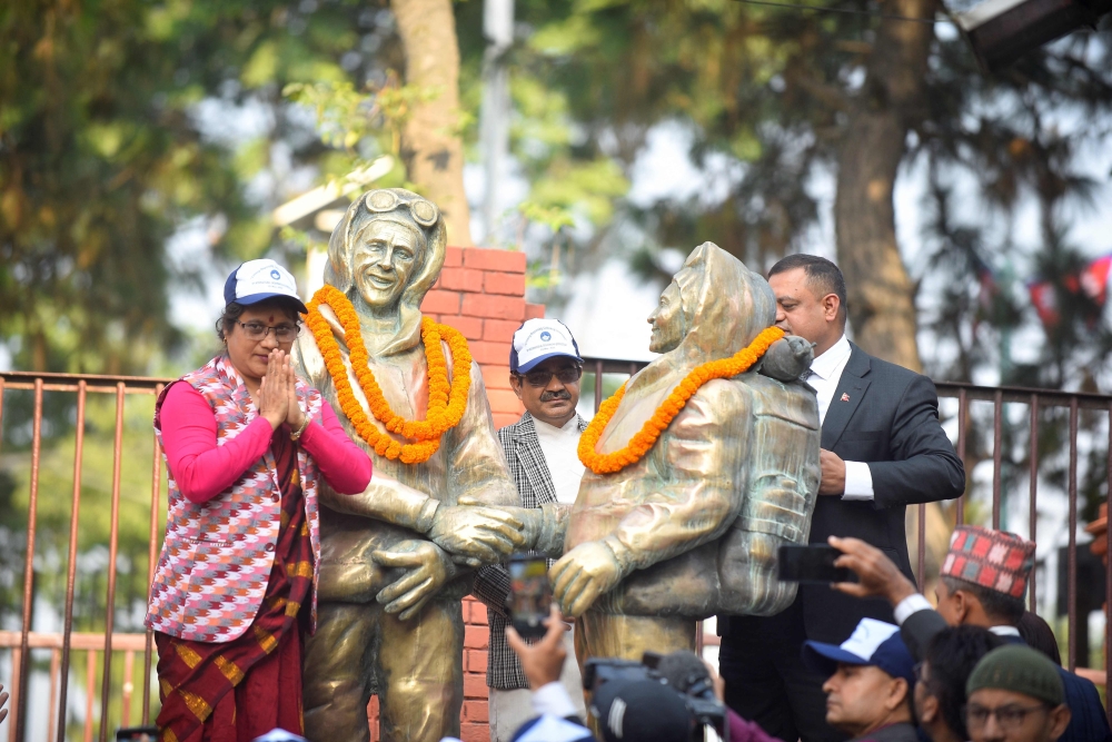 Nepali government officials place garlands on the statues of New Zealand's Sir Edmund Hillary and Nepal's Tenzing Norgay Sherpa to mark the 16th International Everest Day or a day to mark the 70th anniversary of the first ascent of Mount Everest in Kathmandu on May 29, 2023. (Photo by Nisha Bhandari / AFP)
