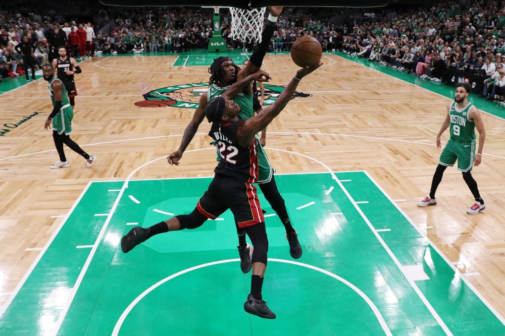 Jimmy Butler #22 of the Miami Heat shoots the ball against Robert Williams III #44 of the Boston Celtics during the third quarter in game seven of the Eastern Conference Finals at TD Garden on May 29, 2023 in Boston, Massachusetts. Maddie Meyer/Getty Images/AFP