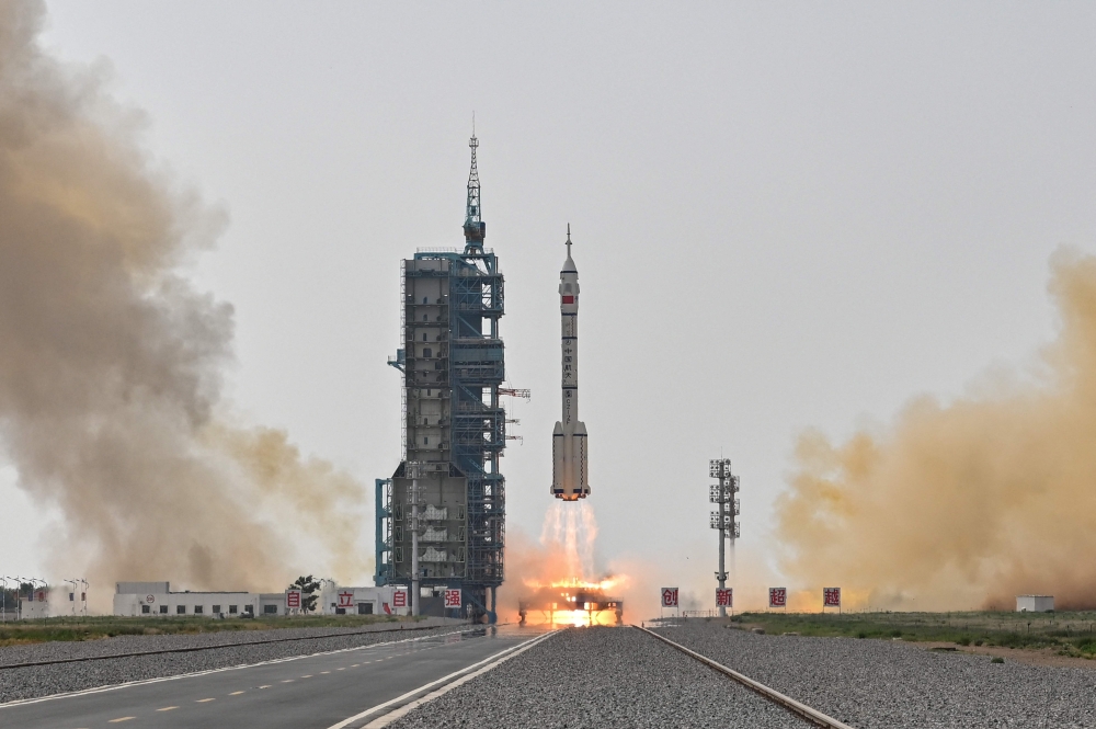 Long March-2F rocket, carrying the Shenzhou-16 Manned Space Flight Mission, lifts off from the Jiuquan Satellite Launch Centre in China's northwestern Gansu province, on May 30, 2023, heading to the Tiangong space station. Photo by Hector RETAMAL / AFP