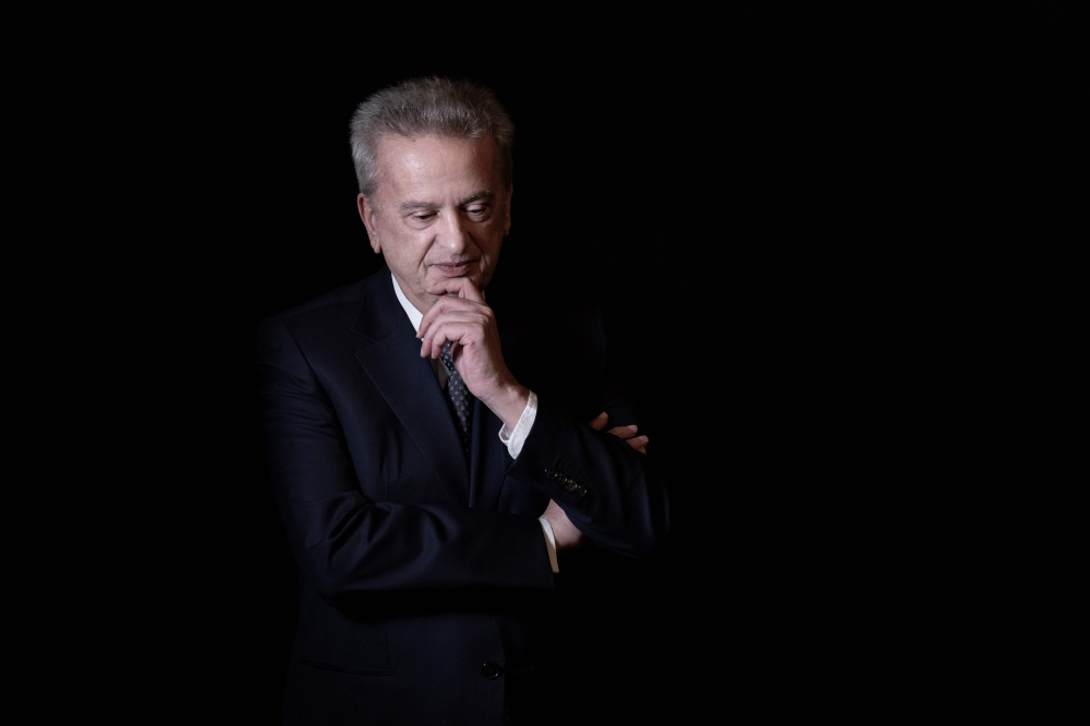 A file photo taken on December 20, 2021 shows Lebanon's Central Bank governor Riad Salameh posing during a studio photo session in Beirut. (Photo by Joseph Eid / AFP)
