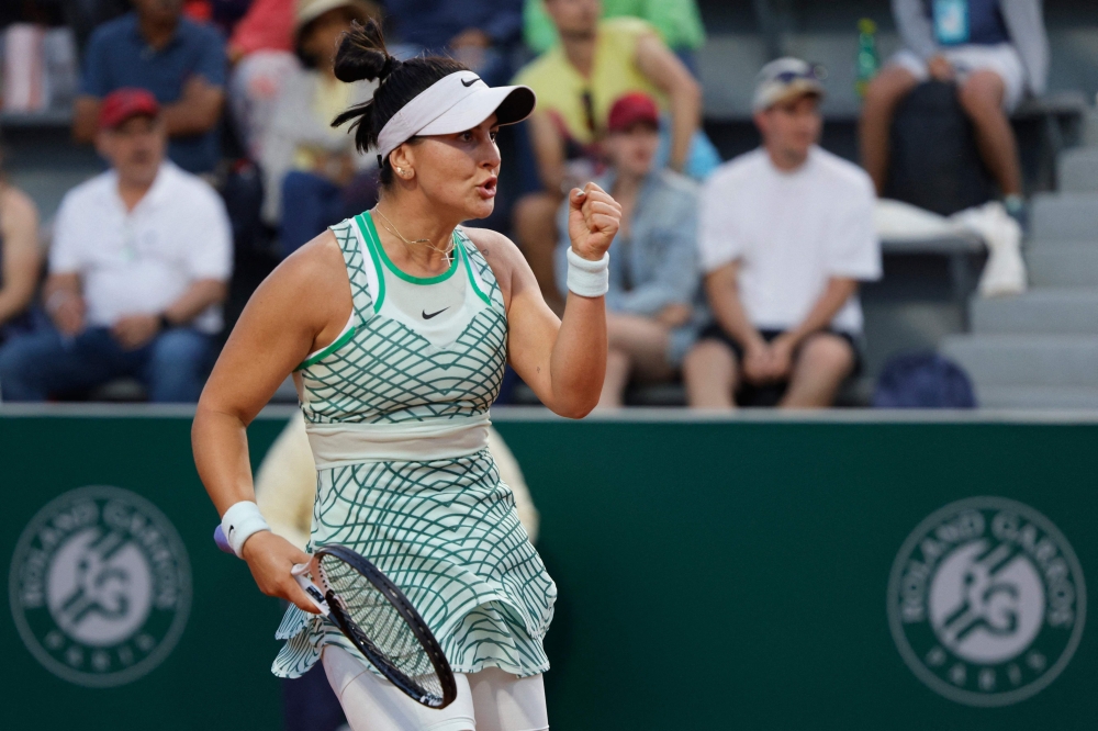 Canada's Bianca Andreescu reacts after a point to Spain's Carla Suarez Navarro during their women's singles match on day five of the Roland-Garros Open tennis tournament in Paris on June 1, 2023. Photo by Geoffroy Van der Hasselt / AFP