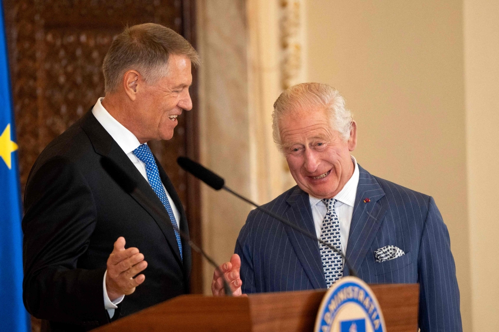 Britain's King Charles III (right) speaks with Romanian President Klaus Iohannis during a press conference at the Cotroceni Presidential Palace in Bucharest, on June 2, 2023. (Photo by MIHAI BARBU / AFP)