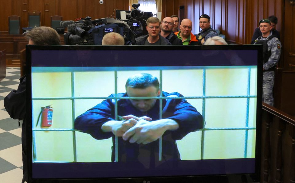 Jailed Russian opposition leader Alexei Navalny is seen on a screen during a court hearing in Moscow. (Reuters file photo)