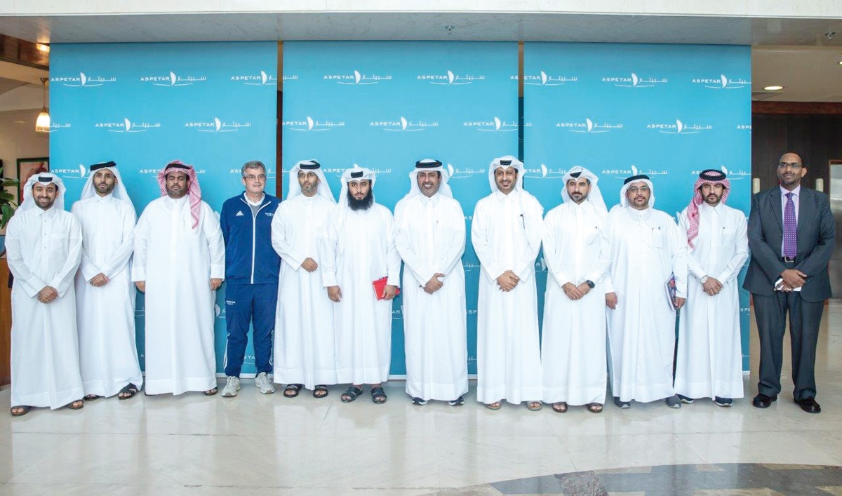 Aspire Zone Foundation officials with QU students during their visit to the facilities.