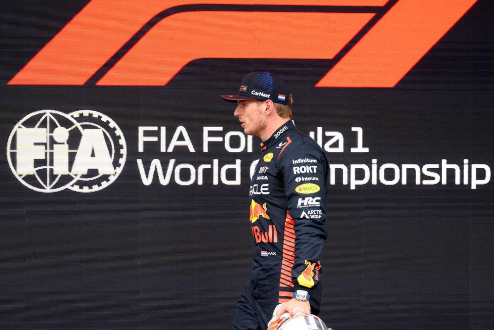 First placed Red Bull's Dutch driver Max Verstappen walks to podium at the end of the qualifying session for the Spanish Formula One Grand Prix at the Circuit de Catalunya on June 3, 2023 in Montmelo, on the outskirts of Barcelona. (Photo by Josep LAGO / AFP)