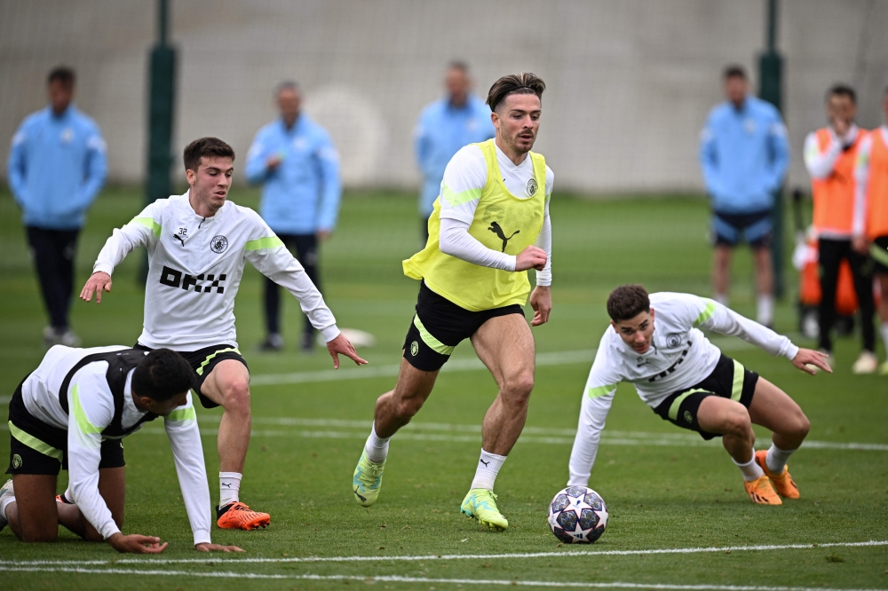 Manchester City's English midfielder Jack Grealish (C) takes part in a team training session at Manchester City training ground in Manchester, north-west England on June 6, 2023, ahead of their UEFA Champions League final football match against Inter Milan. (Photo by Paul Ellis / AFP)