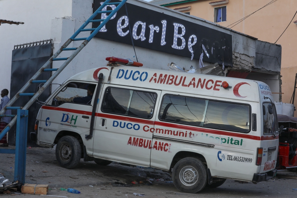 An ambulance enters the site of an attack at the Palm Beach Hotel in Mogadishu on June 10, 2023. (Photo by Hassan Ali Elmi / AFP)