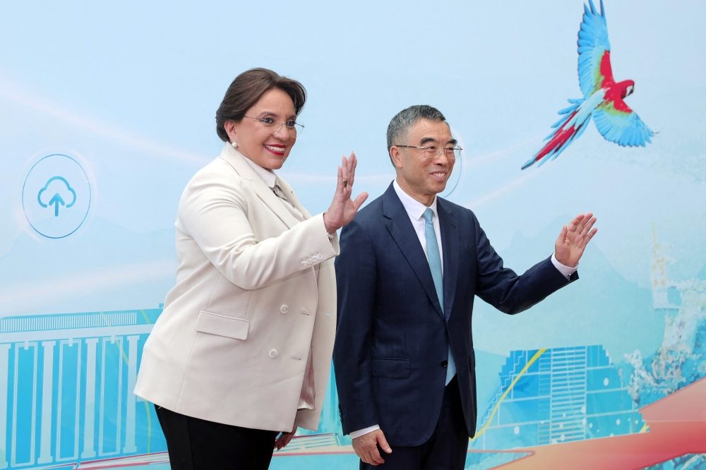 Honduran President Xiomara Castro (L) poses with Chairman of Huawei's Board of Directors Liang Hua, during her visit to Huawei Research Center in Shanghai on June 10, 2023. (Photo by CNS / AFP) / China OUT