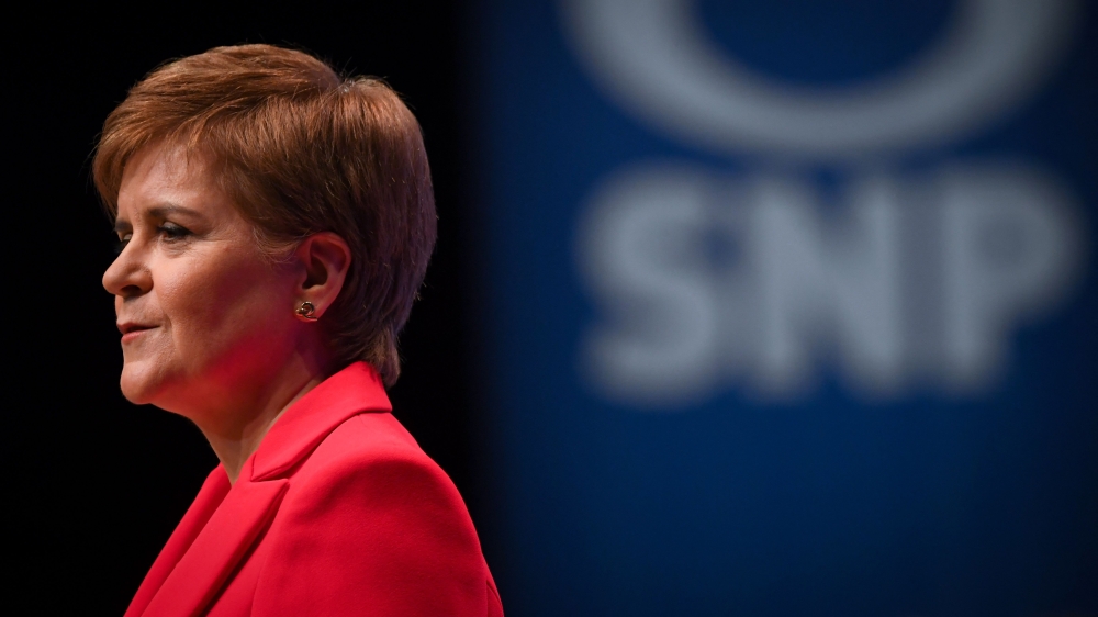 (FILES) Scotland's First Minister and leader of the Scottish National Party (SNP), Nicola Sturgeon, reacts as she delivers her speech to delegates at the annual SNP Conference in Aberdeen, Scotland, on October 10, 2022. (Photo by ANDY BUCHANAN / AFP)