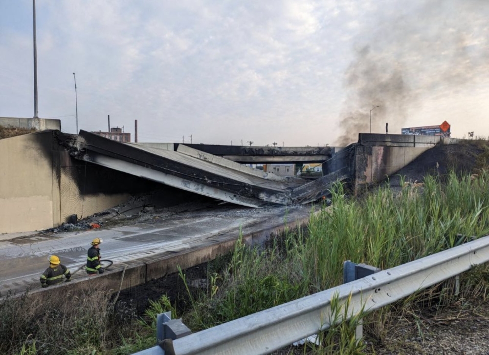 This handout image provided by the Philadelphia Office of Emergency Management on June 11, 2023, shows a portion of collapsed road caused by a large vehicle fire in Philadelphia, Pennsylvania. (Photo by Handout / Philadelphia Office of Emergency Management / AFP) 