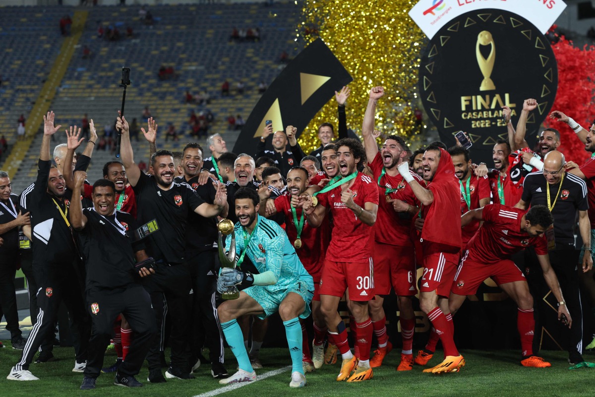 Ahly's players celebrate with the trophy after winning the CAF Champions League final football match between Morocco's Wydad AC and Egypt's Al-Ahly at the Mohammed V Stadium in Casablanca on June 11, 2023. (Photo by Fadel Senna / AFP)