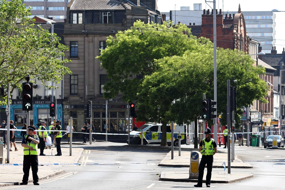 A police officer stands by a cordon outside the Theatre Royal on Upper Parliament Street in Nottingham, central England. (Photo by Darren Staples / AFP)