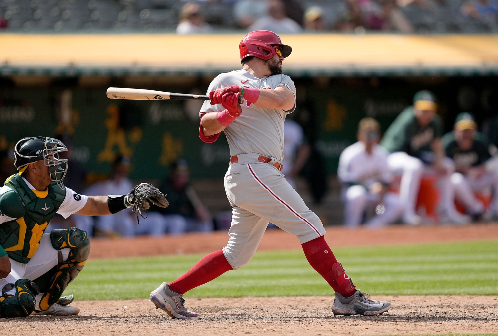 Kyle Schwarber #12 of the Philadelphia Phillies hits an rbi single scoring Cristian Pache #19 against the Oakland Athletics in the top of the 12th inning at RingCentral Coliseum on June 17, 2023 in Oakland, California. (Photo by Thearon W. Henderson / GETTY IMAGES NORTH AMERICA / Getty Images via AFP)