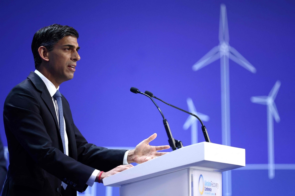 Britain's Prime Minister Rishi Sunak delivers the opening speech on the first day of the Ukraine Recovery Conference in London on June 21, 2023. (Photo by HENRY NICHOLLS / POOL / AFP)
