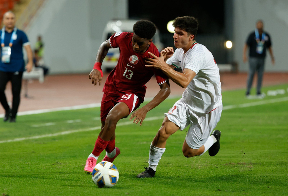 Action during Qatar’s match against Iran on Monday.  