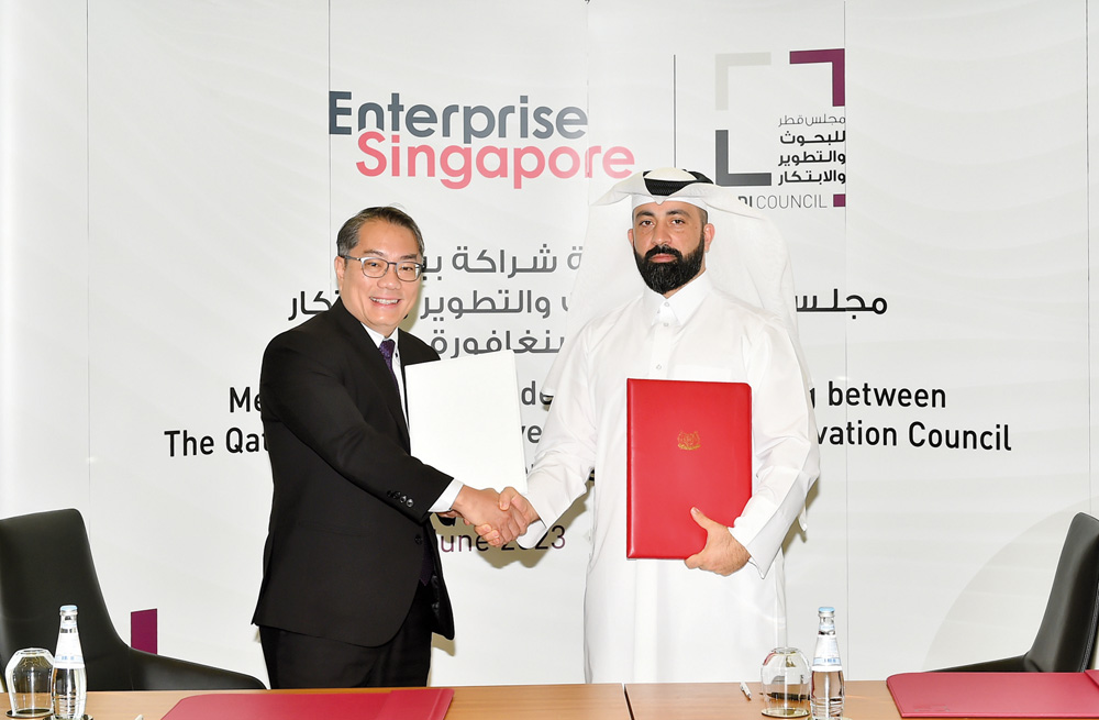 QRDI Secretary General Eng. Omar Al Ansari (right) and Deputy Chief Executive Officer (Global Markets) of Enterprise Singapore Tan Soon Kim during the signing of MoU. PIC: ABDUL BASIT.