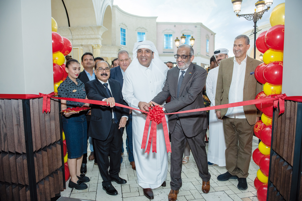 South African Ambassador H E Ghulam Hoosein Asmal (second right), Nando’s Qatar team and Villaggio Mall management at the opening ceremony.  