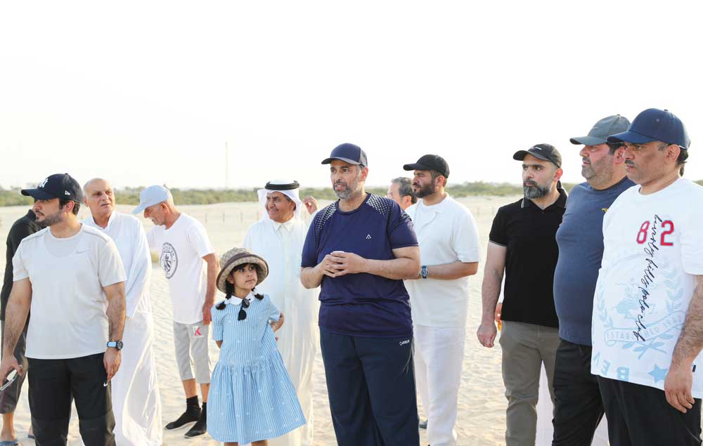 Minister of Environment and Climate Change H E Sheikh Dr. Faleh bin Nasser bin Ahmed bin Ali Al Thani while releasing baby turtles in the sea.