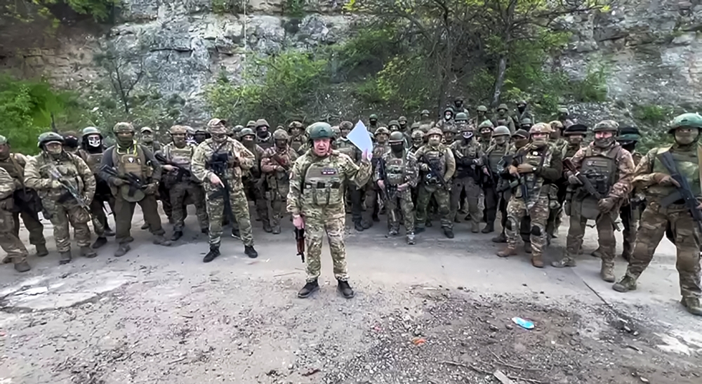 This video grab taken from a handout footage posted on May 5, 2023 on the Telegram account of the press-service of Concord -- a company linked to the chief of Russian mercenary group Wagner, Yevgeny Prigozhin -- shows Yevgeny Prigozhin addressing the Russian army's top brass standing in front of Wagner fighters at an undisclosed location. (Photo by Handout / TELEGRAM/ @concordgroup_official / AFP)