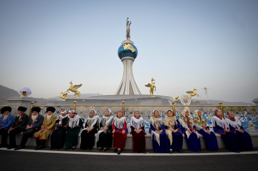 People gather for the ceremony inaugurating the new city of Arkadag - named in honour of Turkmenistan's former leader Gurbanguly Berdymukhamedov - in Arkadag, some 30 kilometres outside the capital Ashgabat, on June 29, 2023. (Photo by Natalia Kolesnikova / AFP)