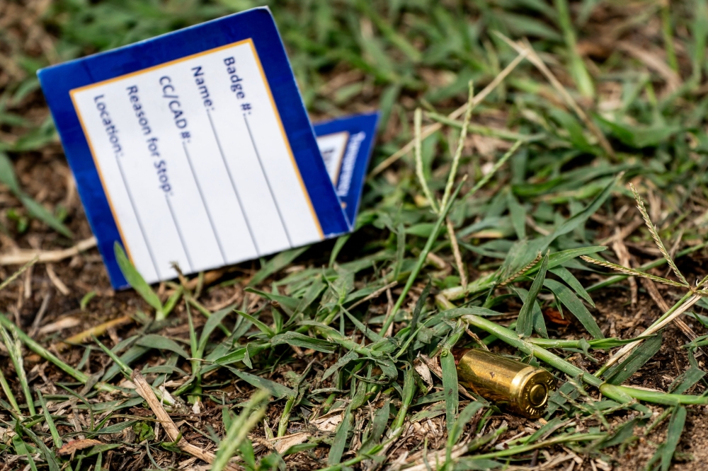 A shell casing is seen at the site of a mass shooting in the Brooklyn Homes neighborhood on July 2, 2023 in Baltimore, Maryland. (Nathan Howard/Getty Images/AFP) 
