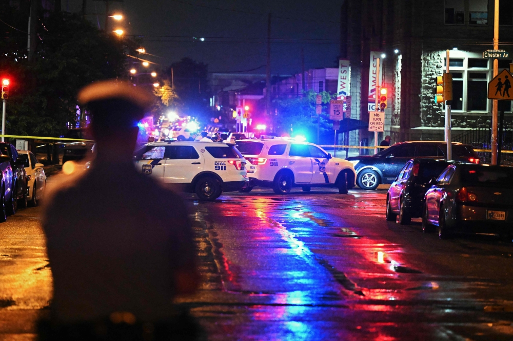 Police work the scene of a shooting on July 3, 2023 in Philadelphia, Pennsylvania. Drew Hallowell/Getty Images/AFP (Photo by Drew Hallowell / GETTY IMAGES NORTH AMERICA / Getty Images via AFP)