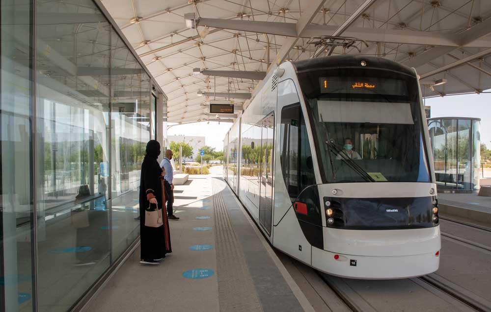 Passengers waiting to board a tram at Education City.