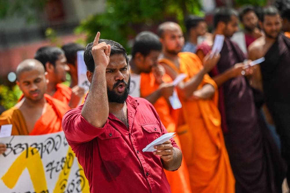 University student activists take part in a demonstration in Maharagama, a suburb of Colombo on July 9, 2023, demanding the release of some of their colleagues in police custody and to mark the first year anniversary of the toppling of former president Gotabaya Rajapaksa. (Photo by Ishara S. KODIKARA / AFP)
