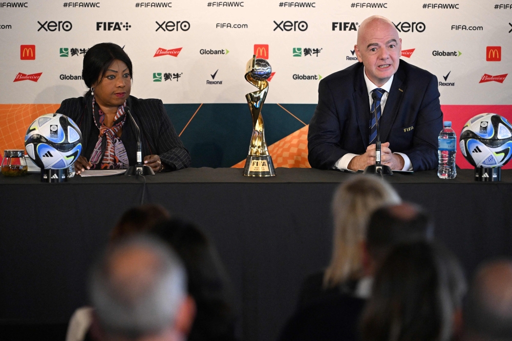 FIFA president Gianni Infantino (R) and FIFA Secretary General Fatma Samoura attend a press conference in Auckland on July 19, 2023, ahead of the Women's World Cup football tournament. (Photo by Saeed Khan / AFP)