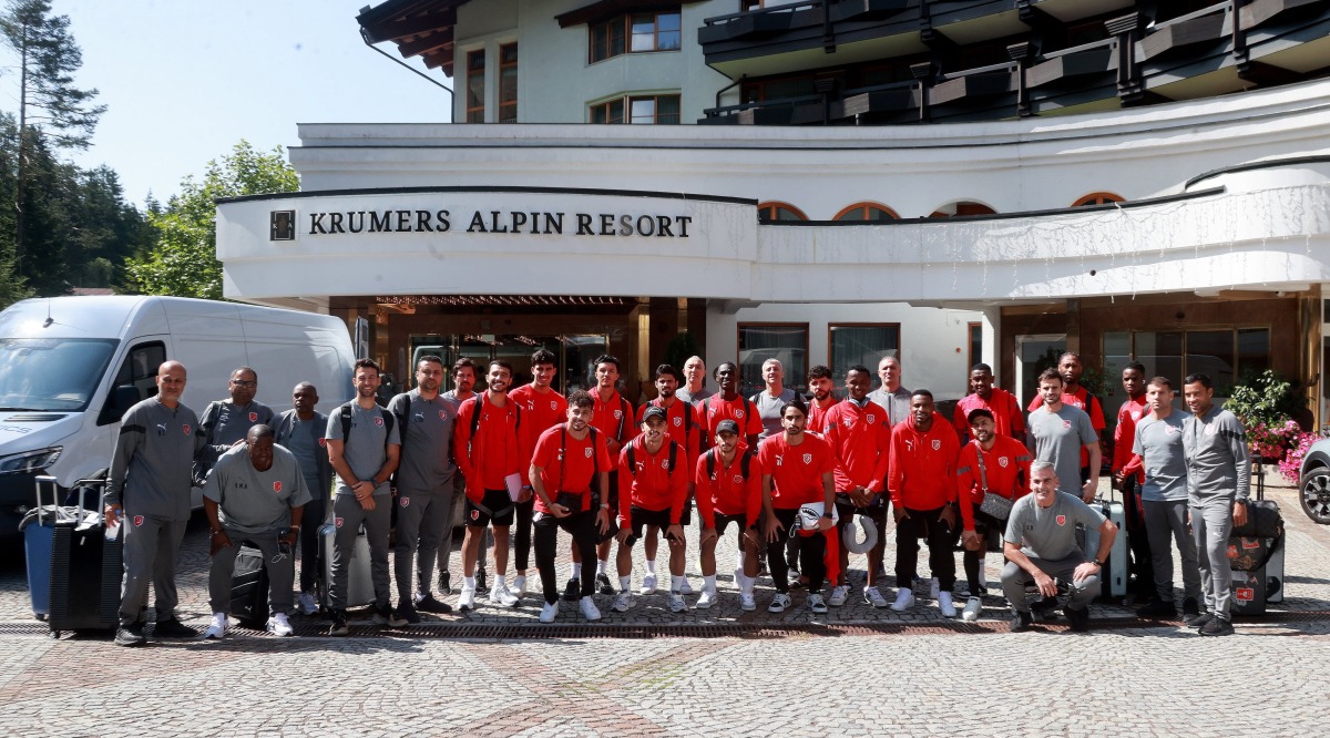 Al Duhail players and officials pose for a photograph after arriving in Seefeld, Austria for their training camp, yesterday.