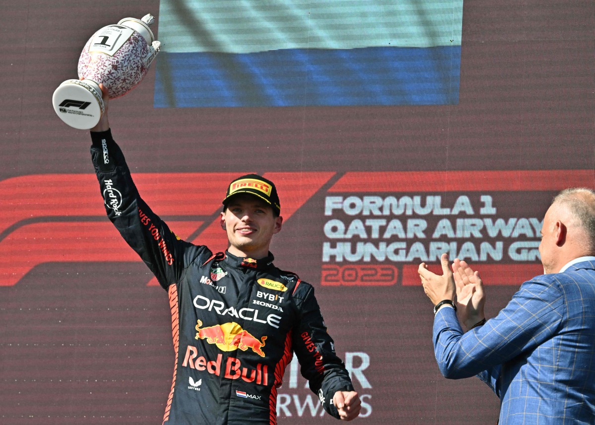 Max Verstappen raises the trophy after winning the Formula One Hungarian Grand Prix, yesterday. AFP