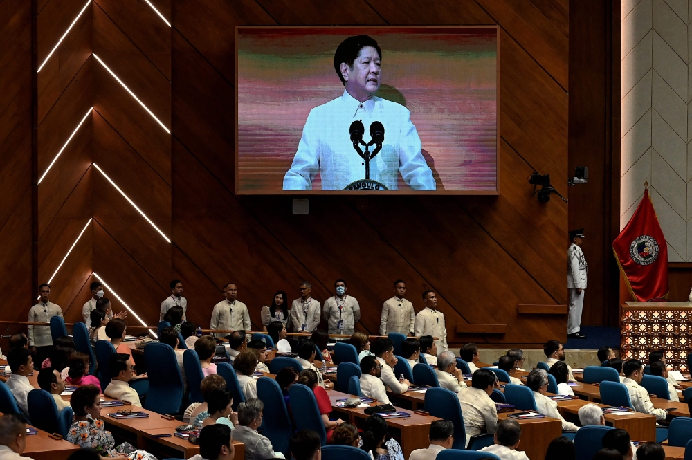 Philippine President Ferdinand Marcos Jr delivers his speech during the State of the Nation Address (SONA) at the House of Representatives in Quezon City on July 24, 2023. (Photo by JAM STA ROSA / AFP)
