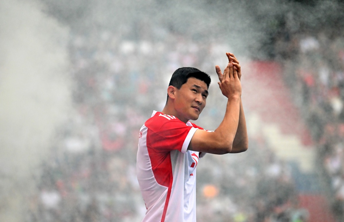 Bayern Munich's new South Korean defender Kim Min-jae applauds the fans during the team presentation of the German first division Bundesliga club Bayern Munich in the stadium in Munich, southern Germany, on July 23, 2023. Photo by Christof STACHE / AFP