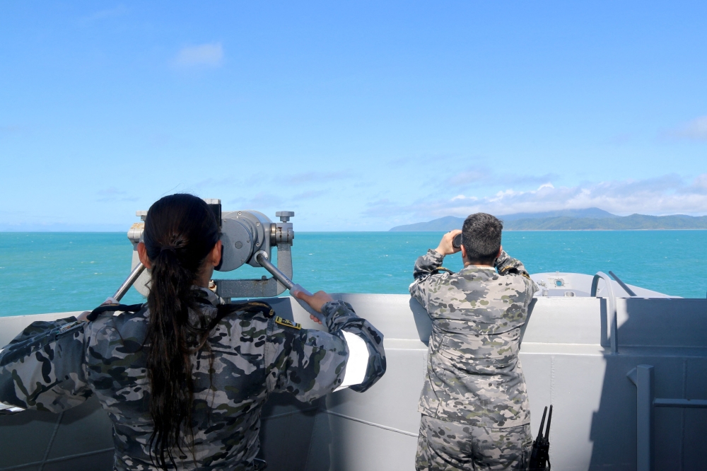 This handout photo taken on July 29, 2023 and received on July 30 from the Australian Defence shows Royal Australian Navy sailors conduct search and rescue operations in the vicinity of Lindeman Island, Queensland. Photo by AUSTRALIAN DEFENCE / AFP