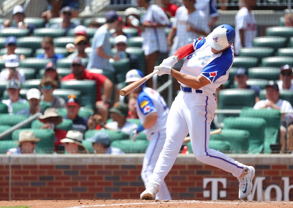 Matt Olson #28 of the Atlanta Braves hits a three-run homer in the third inning against the Milwaukee Brewers at Truist Park on July 30, 2023 in Atlanta, Georgia. Kevin C. (Photo by Kevin C. Cox / GETTY IMAGES NORTH AMERICA / Getty Images via AFP)
