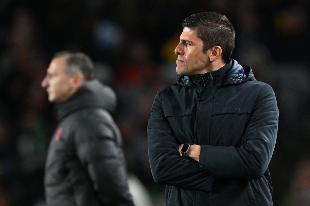 Portugal's coach Francisco Neto (R) looks on next to USA's coach Vlatko Andonovski (L) during the Australia and New Zealand 2023 Women's World Cup Group E football match between Portugal and the United States at Eden Park in Auckland on August 1, 2023. Photo by Saeed KHAN / AFP