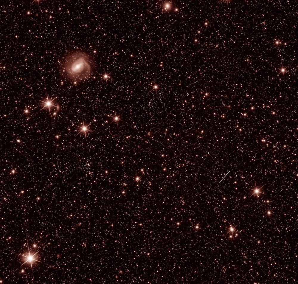 This handout photo provided courtesy of ESA/Euclid/Euclid Consortium/NASA on July 31, 2023, shows a test photo taken during commissioning of ESA / Euclid spacecraft, to check that the Near Infrared Spectrometer and Photometer (NISP) instrument is working as expected. (Photo by ESA/Euclid/Euclid Consortium/NASA / AFP) 