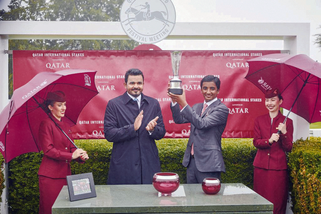 Qatar Olympic Committee President H E Sheikh Joaan bin Hamad Al Thani presented the winner's trophy to the representative of Al Shaqab Racing - owner of Al Ghadeer who clinched the Qatar International Stakes at the Qatar Goodwood Festival at Goodwood Racecourse, yesterday. Pictures: Dominic James