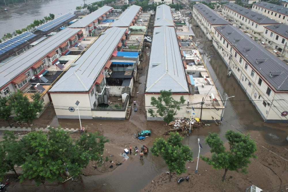 The aerial view shows a flooded village in the aftermath of the flooding following heavy rains in Beijing on August 3, 2023. (Photo by Jade Gao / AFP)