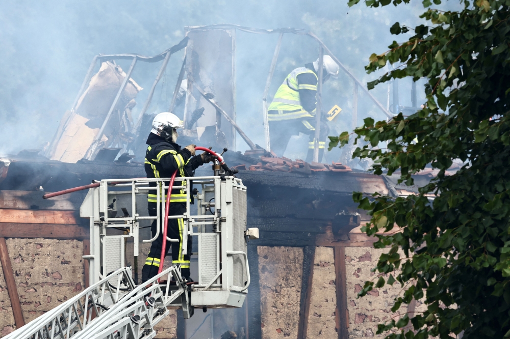 Firefighters work to extinguish a fire which erupted at a home for disabled people in Wintzenheim near Colmar, eastern France, on August 9, 2023. Photo by Sebastien BOZON / AFP