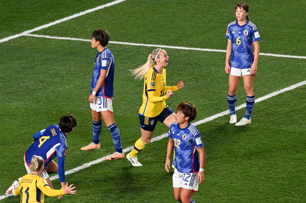 Sweden's defender #13 Amanda Ilestedt celebrates her goal at Eden Park in Auckland on August 11, 2023. (Photo by Saeed Khan / AFP)