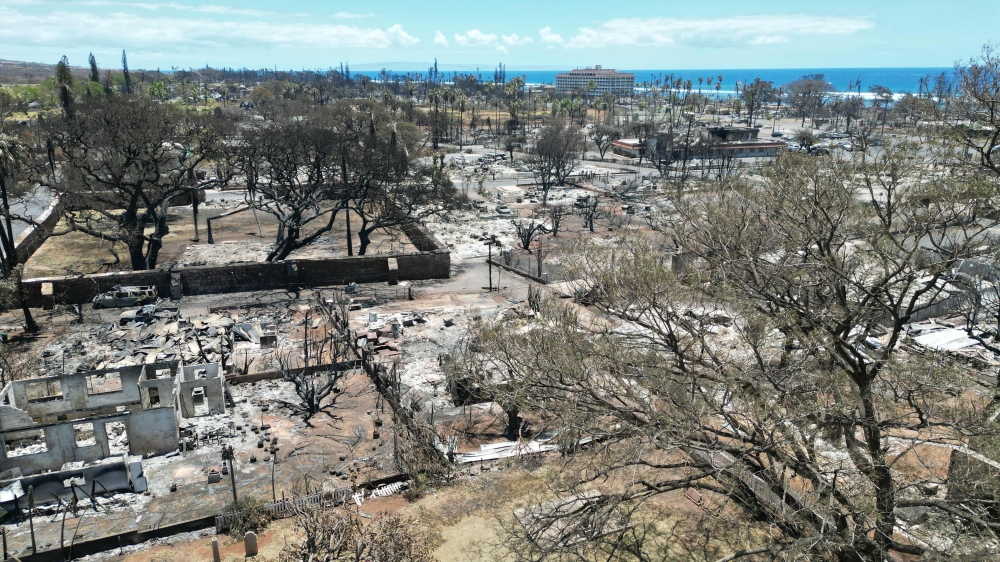 This aerial photo shows destroyed buildings and homes in the aftermath of a wildfire in Lahaina, western Maui, Hawaii on August 11, 2023. (Photo by Sébastien Vuagnat / AFP)