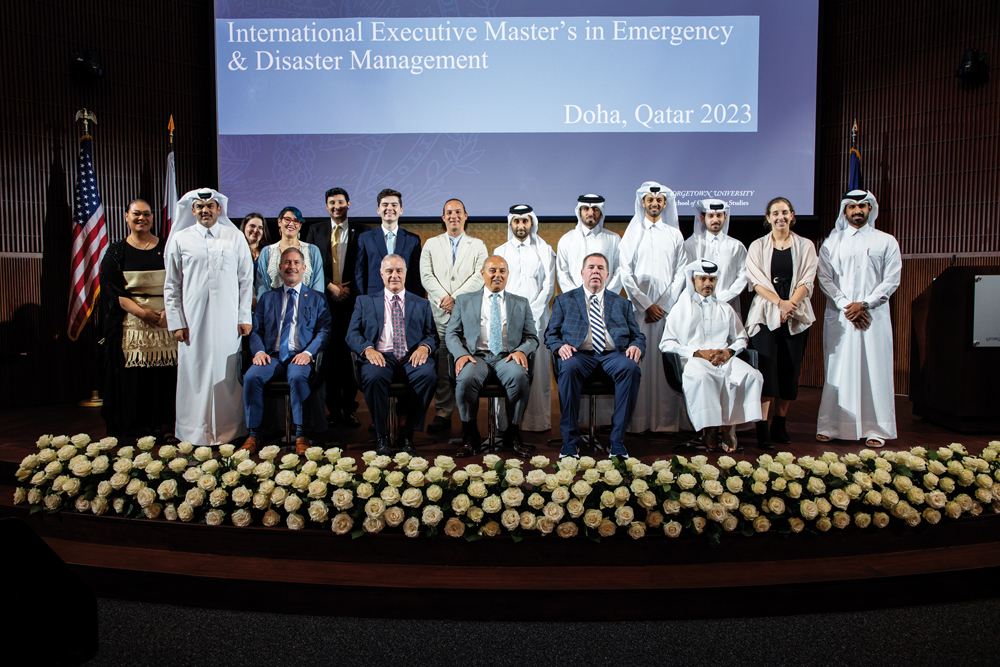 GU-Q Dean, Dr. Safwan Masri (centre, sitting) and other officials with programme participants. 