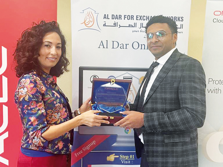 Mohammed Amgad, Deputy CEO, Al Dar For Exchange Works with Hanane El Mir, senior director, SMB, Middle East, Turkey, and Africa, Oracle Cloud Infrastructure.