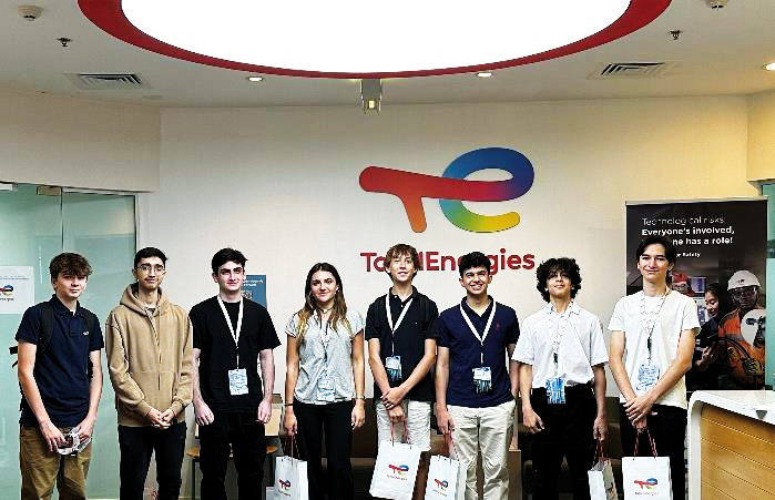 Students pose for a group photo at the conclusion of an internship program.