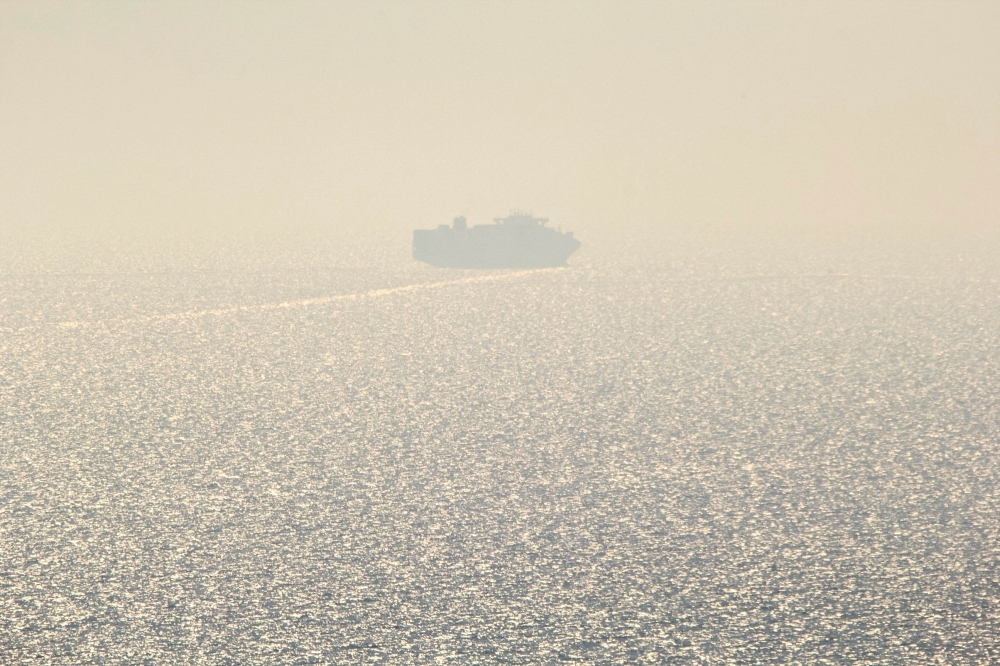 The first cargo ship using new Black Sea shipping lanes is seen leaving the southern port of Odesa in Ukraine on August 16, 2023. (Photo by Stringer / AFP)

