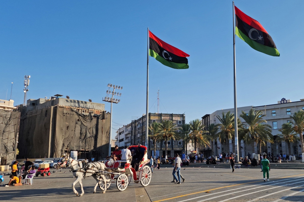 Libyans gather at the Martyrs' Square in Tripoli on August 17, 2023 following recent deadly clashes.(Photo by Mahmud Turkia / AFP)