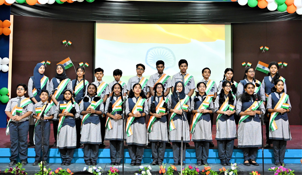 Students performing during the MES Indian School celebration of the 77th Indian Independence Day.