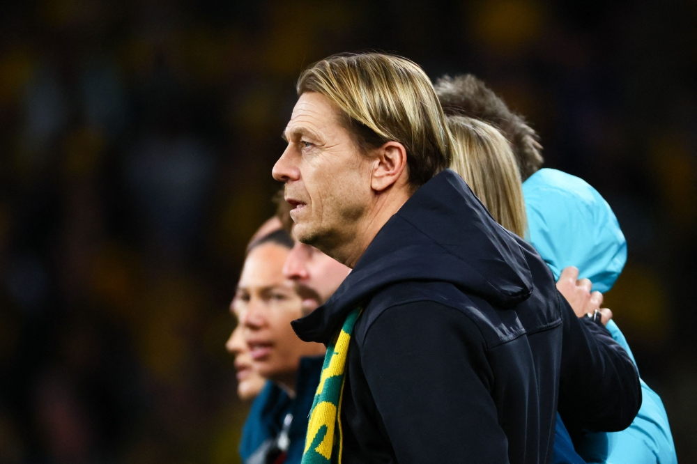 Australia's coach Tony Gustavsson stands for Australia's national anthem before the start of the Australia and New Zealand 2023 Women's World Cup third place play-off football match between Sweden and Australia at Brisbane Stadium in Brisbane on August 19, 2023. Photo by Patrick Hamilton / AFP